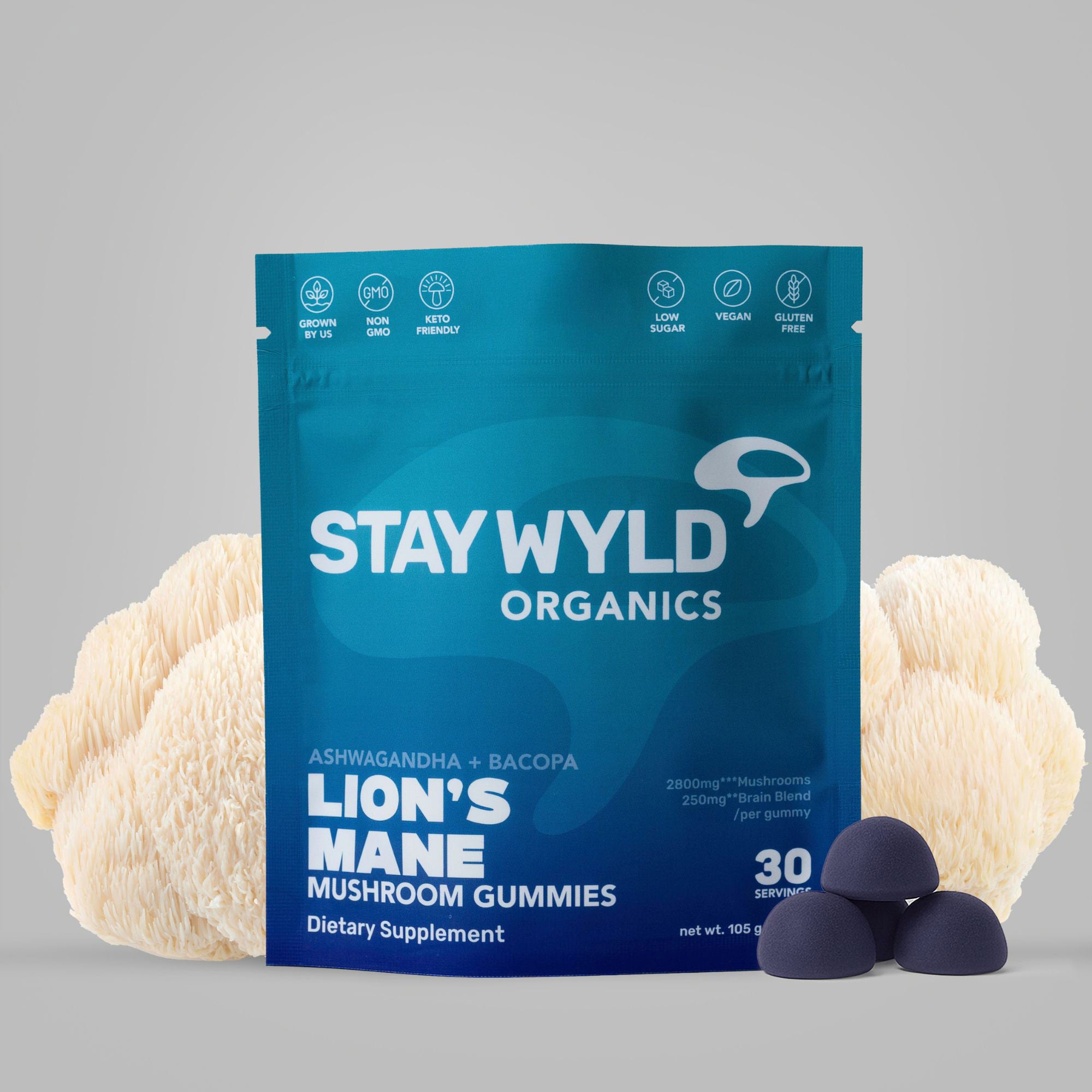 Stay Wyld Organics Lion's Mane Mushroom Gummies packaging with mushrooms on a gray background